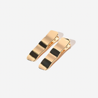 Gold hair clip on a white background