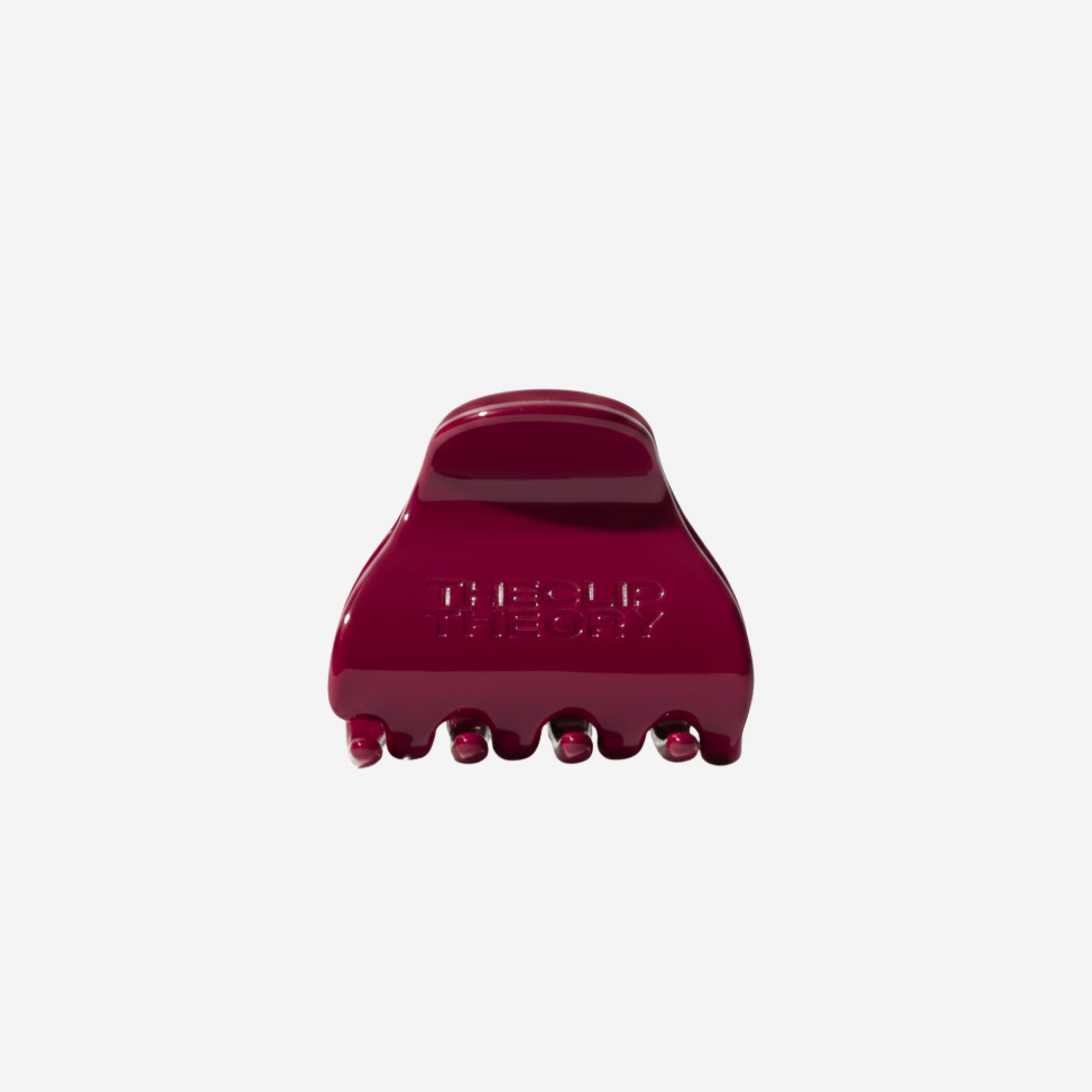 Red hair clip on a white background