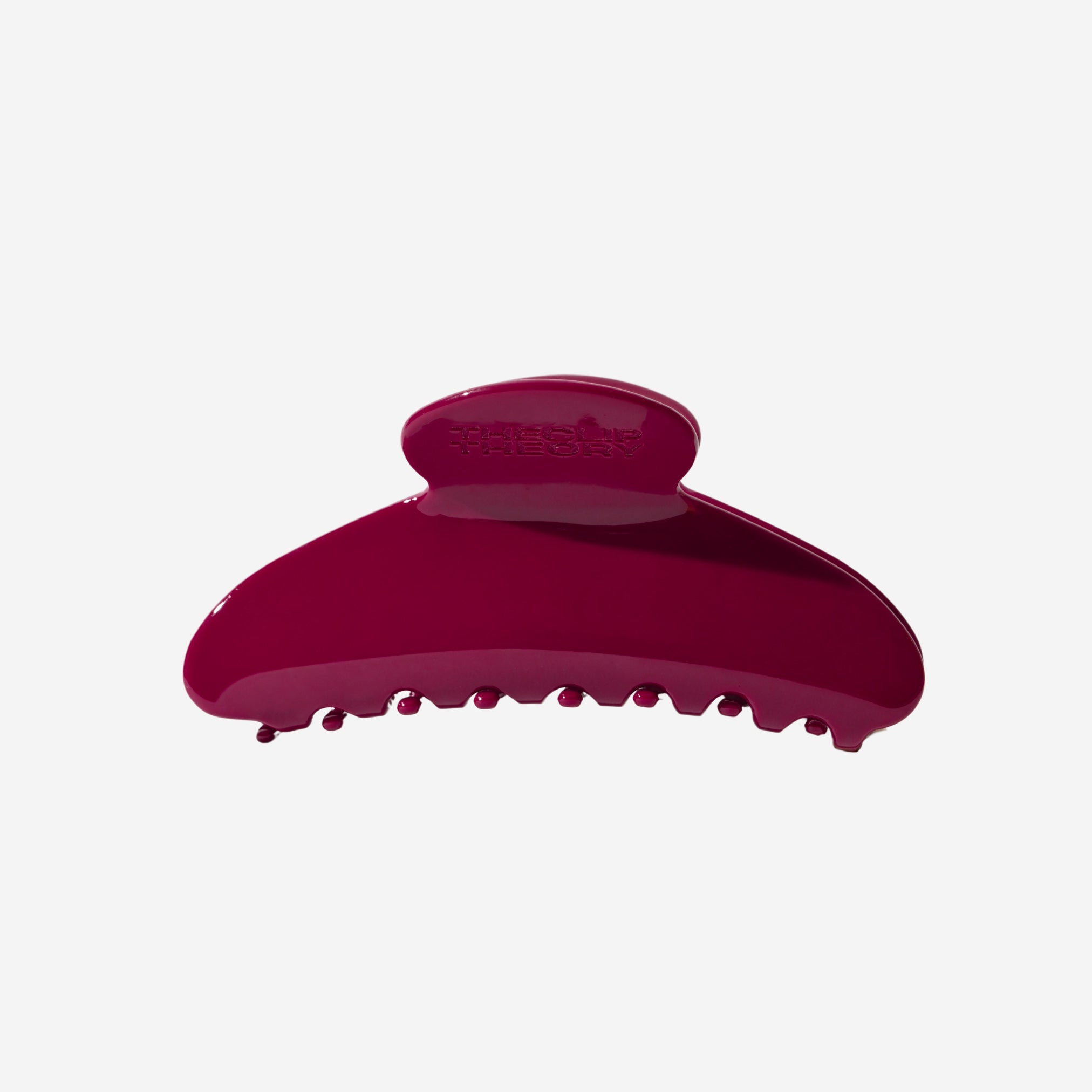 Red hair clip on a white background