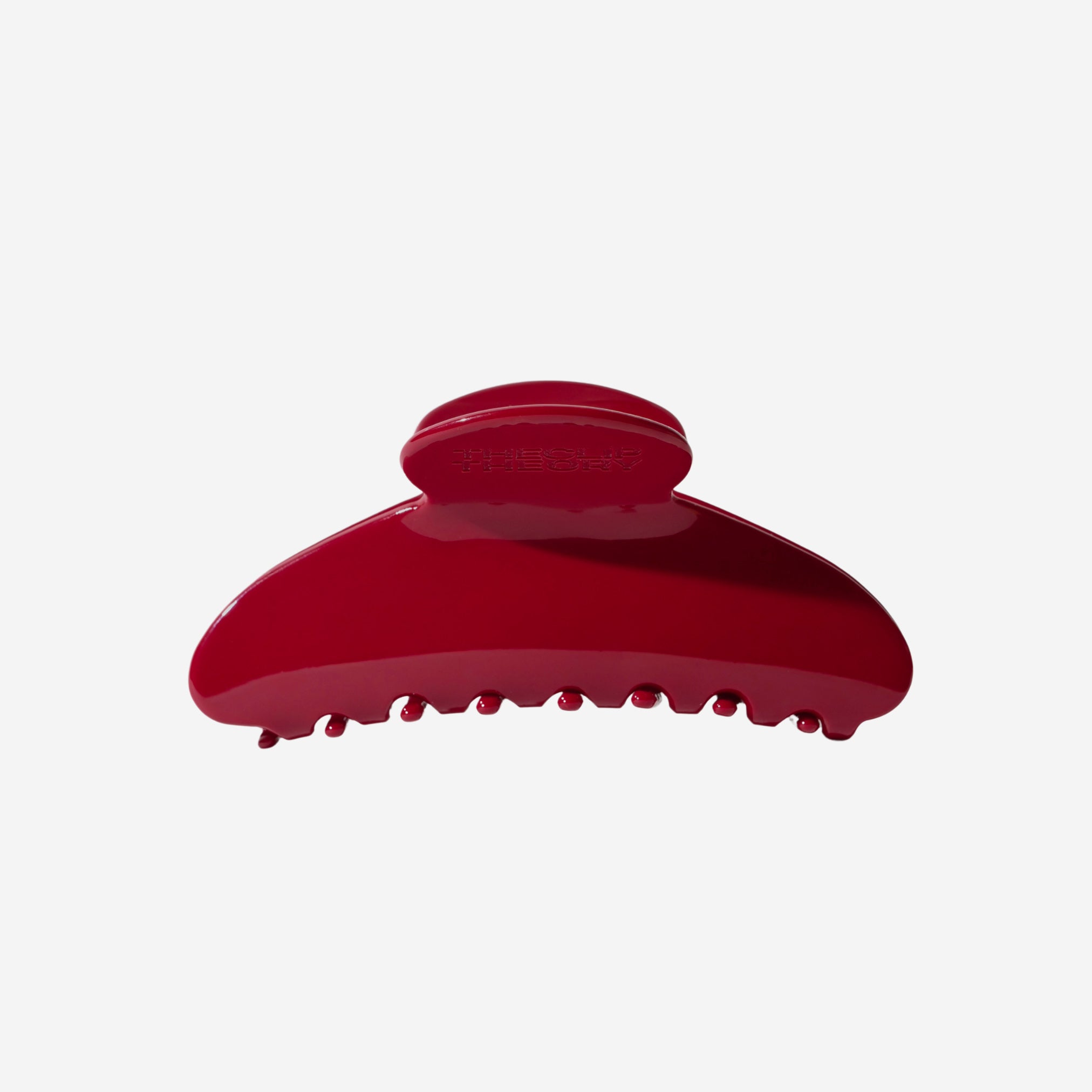 Red hair clip on a white background